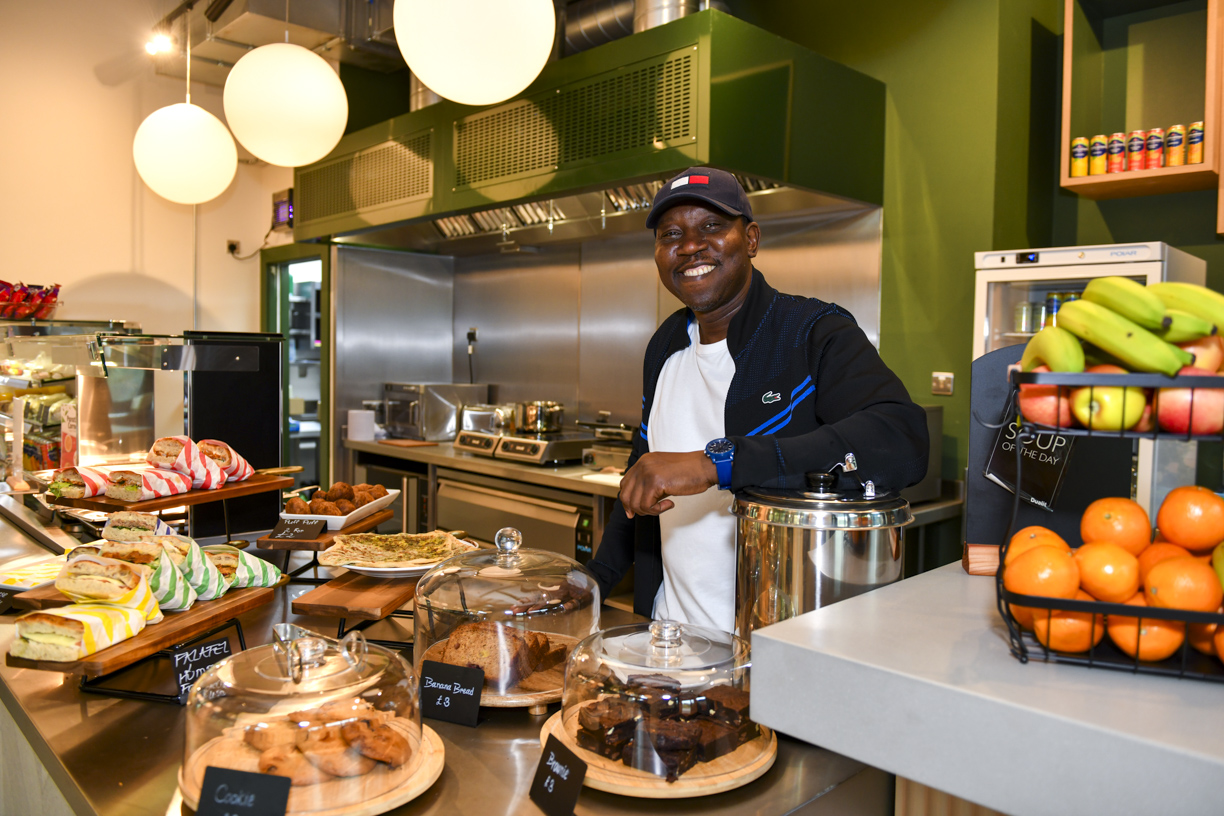 Inside Minnie’s café — fresh sandwiches, cakes and fruit behind the counter